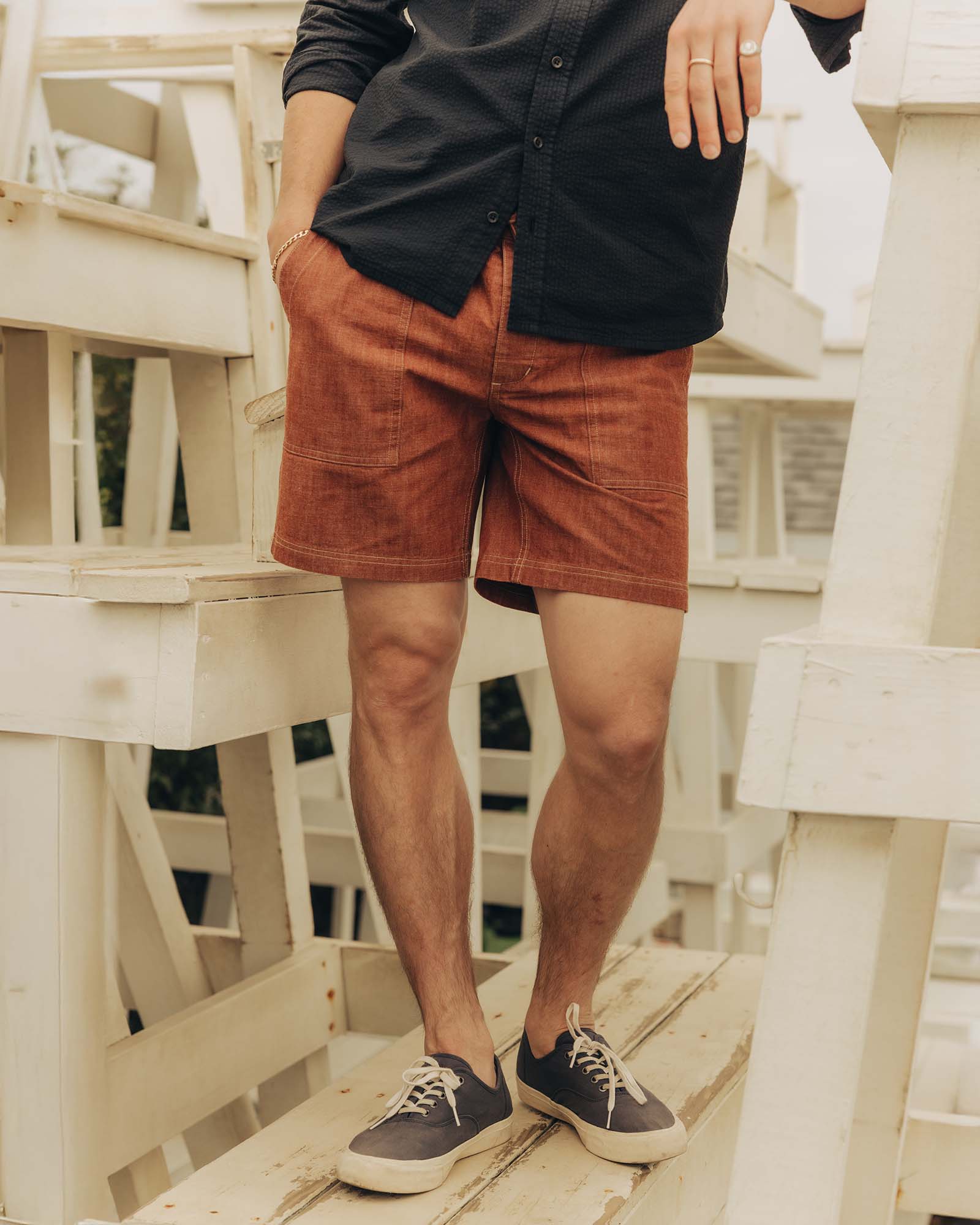 fit model posing in The Breakwater Short in Brick Chambray, Bottoms by Taylor Stitch