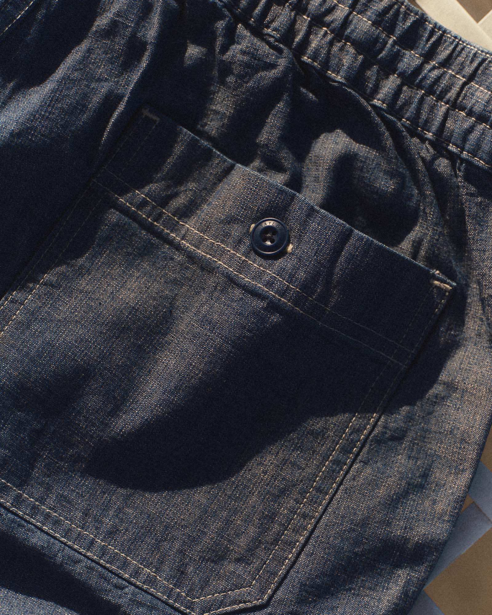 fit model showing off The Breakwater Short in Washed Indigo Chambray, Bottoms by Taylor Stitch