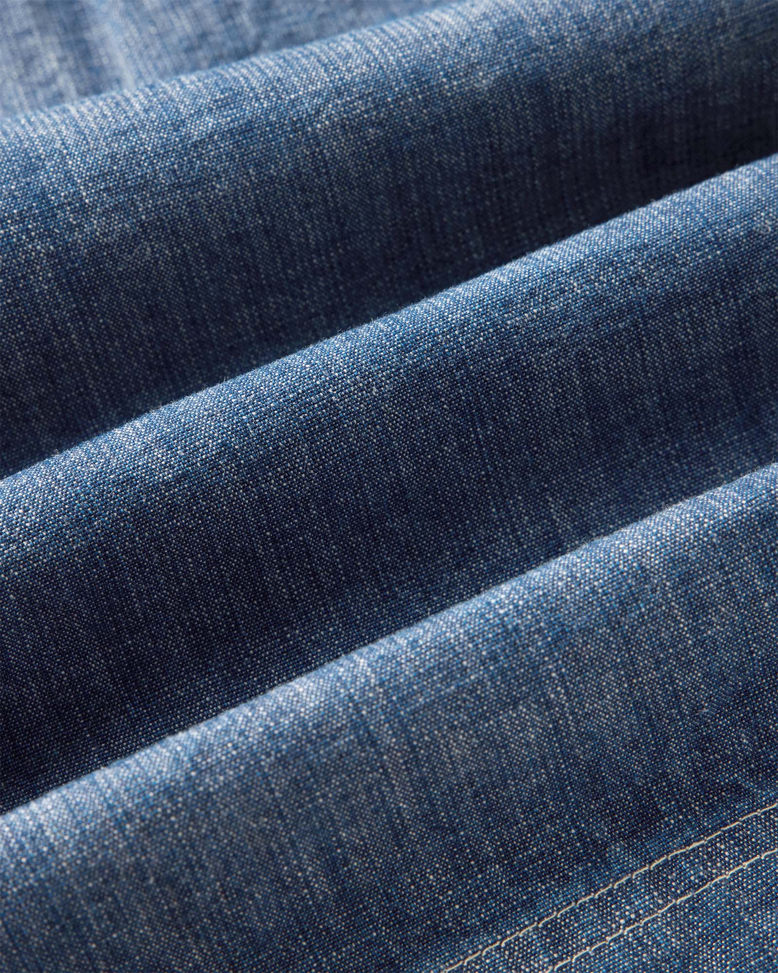 flatlay of the back of The Breakwater Short in Washed Indigo Chambray, Bottoms by Taylor Stitch