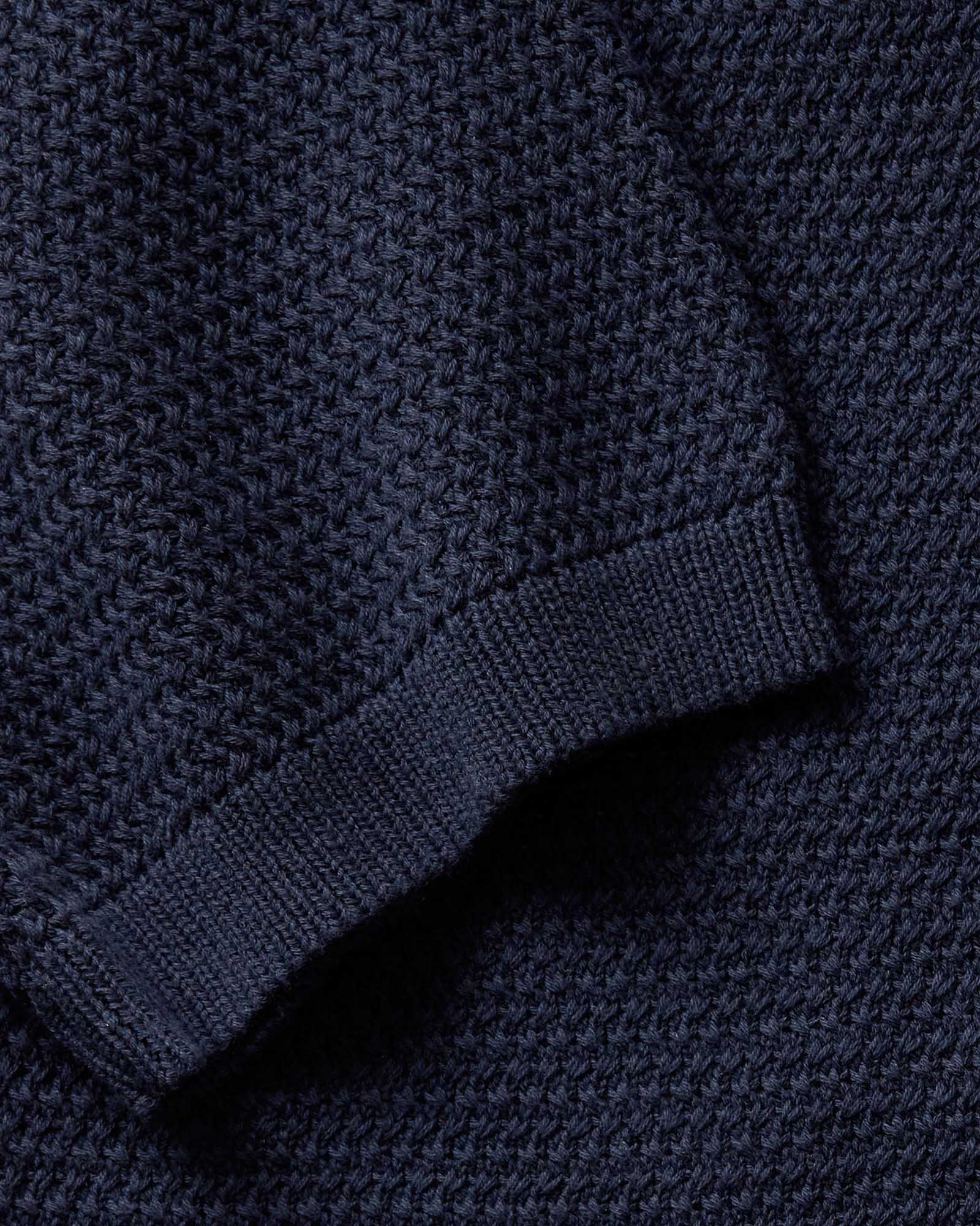 material shot of the sleeve on The Button Down Polo in Dark Navy Crochet, Knits by Taylor Stitch