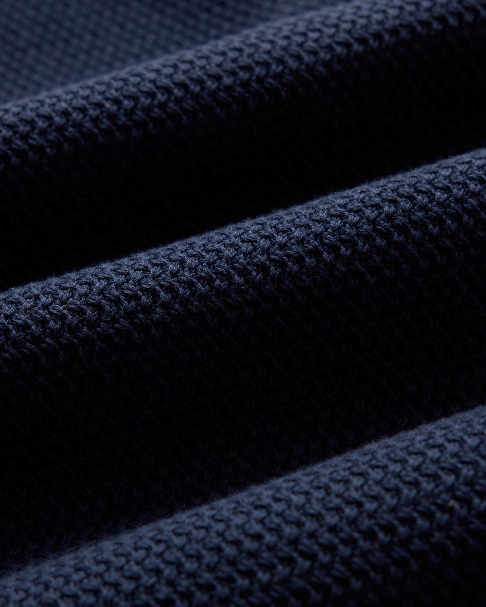 material shot of the fabric on The Button Down Polo in Dark Navy Crochet, Knits by Taylor Stitch