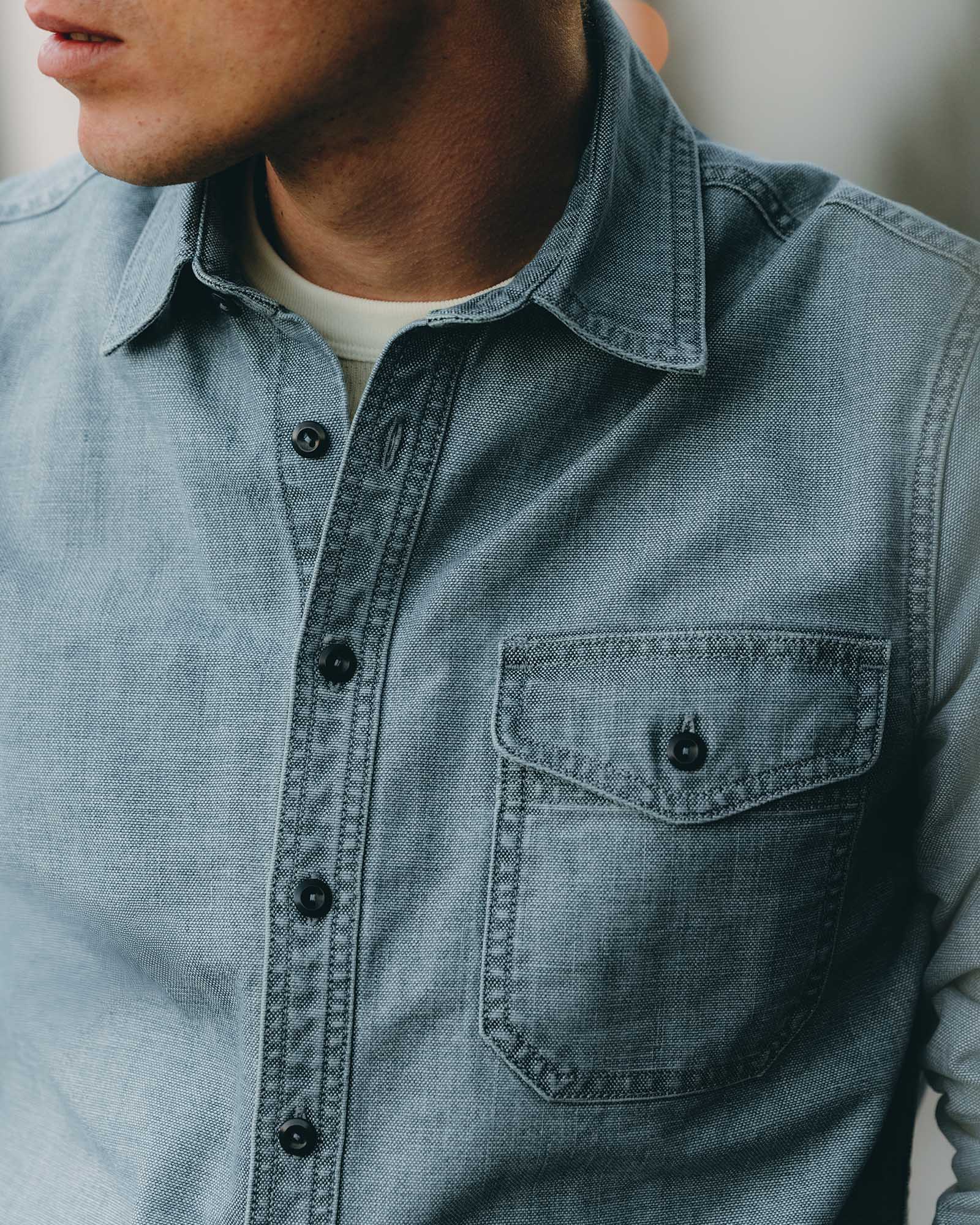 fit model showing off the pocket on The Cadet Shirt in Washed Indigo Oxford, Wovens by Taylor Stitch