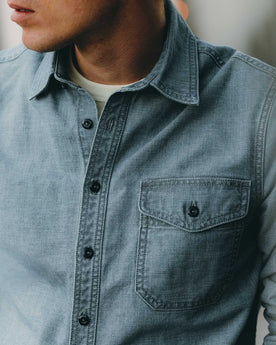 fit model showing off the pocket on The Cadet Shirt in Washed Indigo Oxford, Wovens by Taylor Stitch
