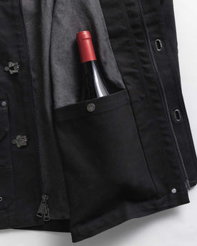 material shot of the inner pocket on The Cinder Jacket in Coal Dry Wax, Outerwear by Taylor Stitch
