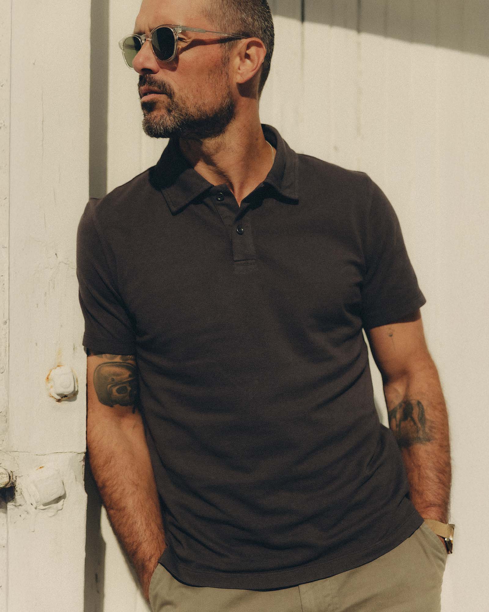 fit model posing in The Cotton Hemp Polo in Asphalt Pique, Knits by Taylor Stitch