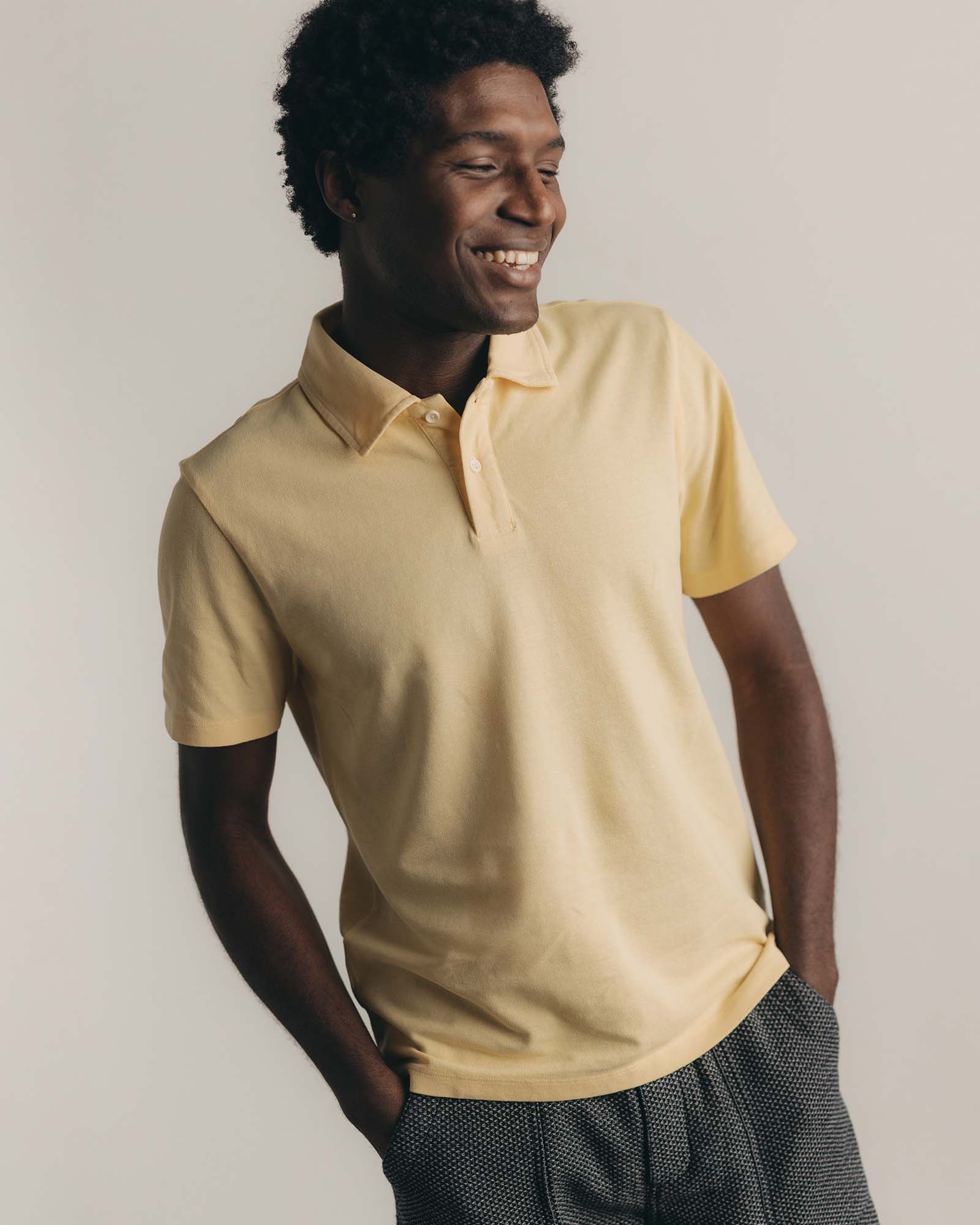 fit model posing in The Cotton Hemp Polo in Straw Pique, Knits by Taylor Stitch