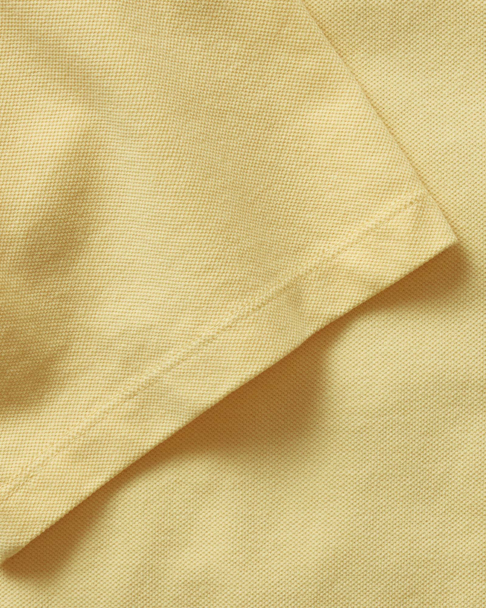 material shot of the sleeve on The Cotton Hemp Polo in Straw Pique, Knits by Taylor Stitch