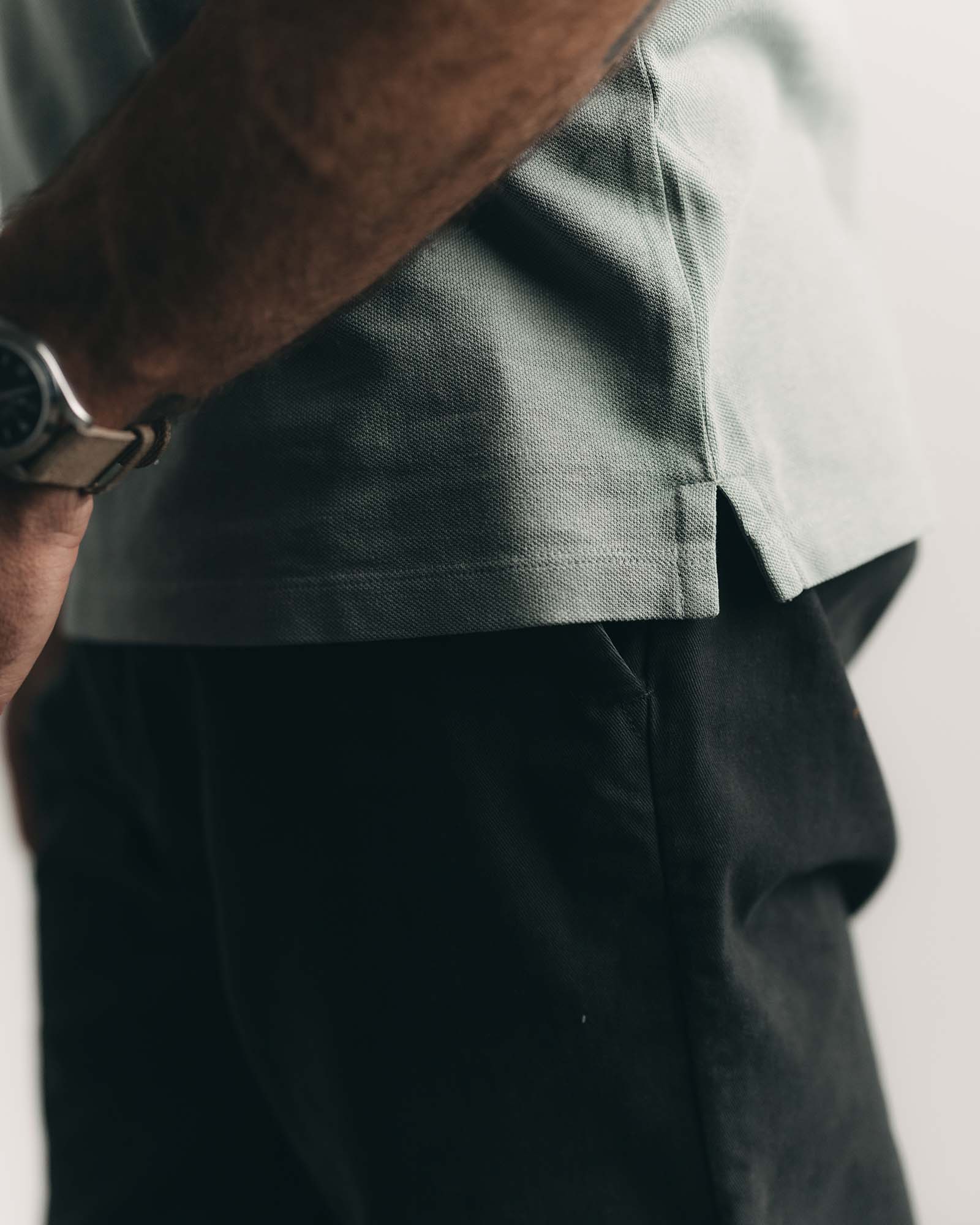 fit model showing off the hem on The Cotton Hemp Polo in Surf Green Pique, Knits by Taylor Stitch