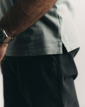 fit model showing off the hem on The Cotton Hemp Polo in Surf Green Pique, Knits by Taylor Stitch