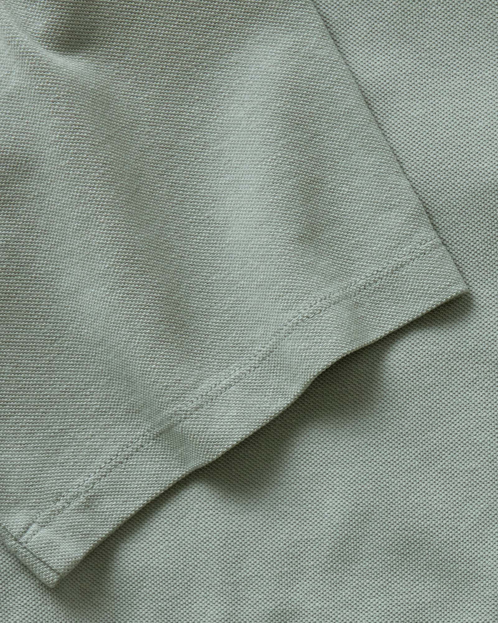 material shot of the sleeve on The Cotton Hemp Polo in Surf Green Pique, Knits by Taylor Stitch