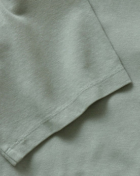 material shot of the sleeve on The Cotton Hemp Polo in Surf Green Pique, Knits by Taylor Stitch