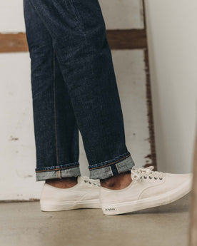 fit model showing off the cuffs on The Democratic Jean in Rinsed Yoshiwa Selvedge, Bottoms by Taylor Stitch