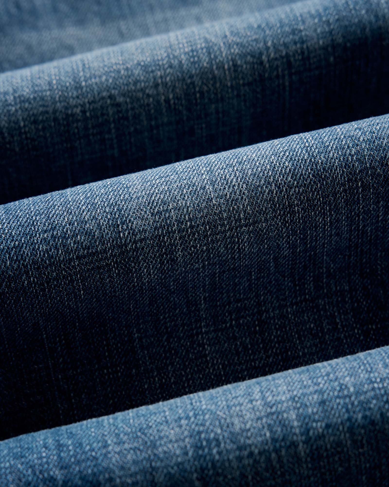 folded flatlay of the back of The Democratic Jean in Mid Wash Organic Selvedge, Bottoms by Taylor Stitch
