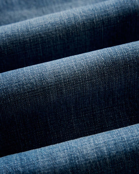 folded flatlay of the back of The Democratic Jean in Mid Wash Organic Selvedge, Bottoms by Taylor Stitch