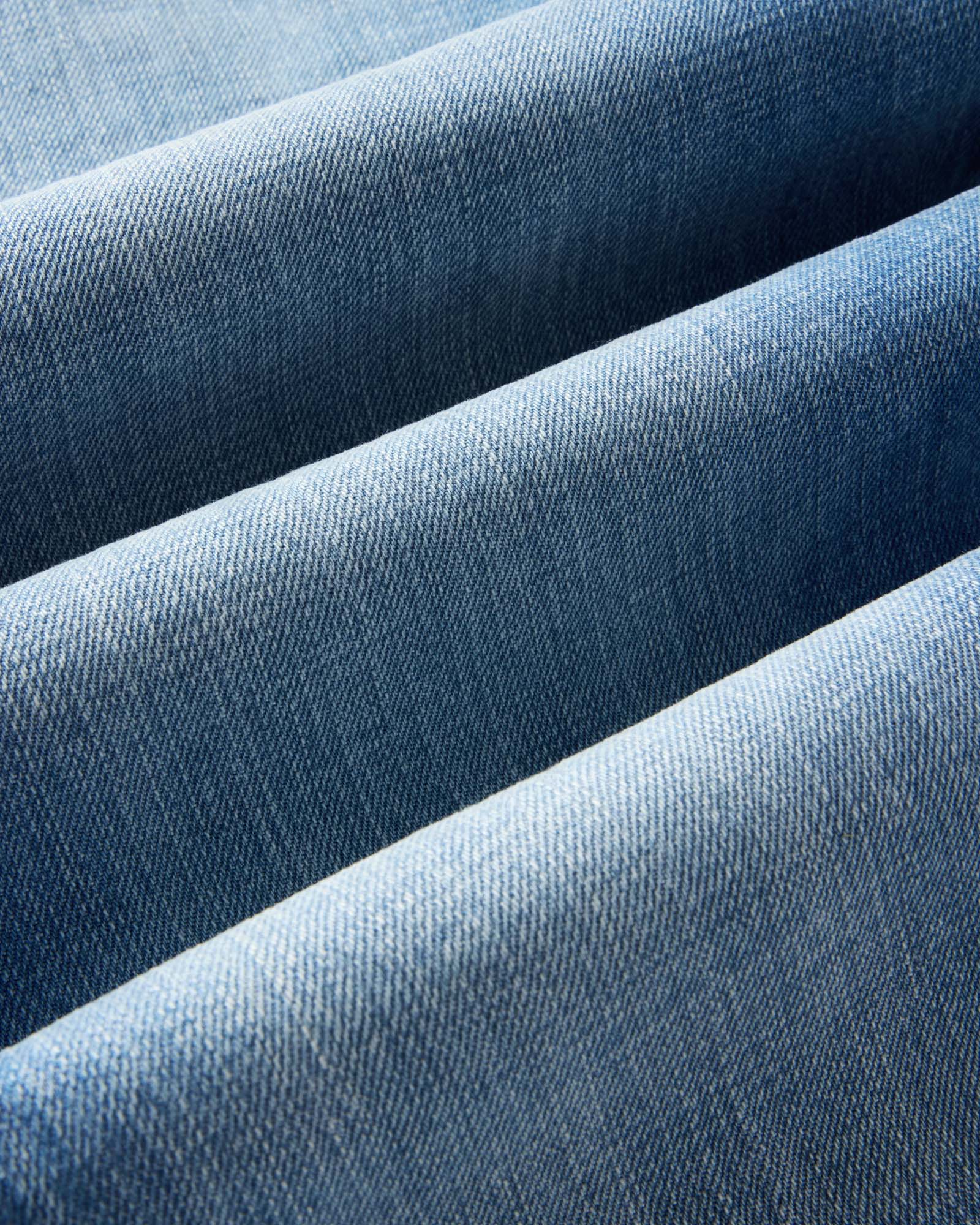 material shot of the fabric on The Democratic Jean in Light Wash Organic Selvedge, Bottoms by Taylor Stitch