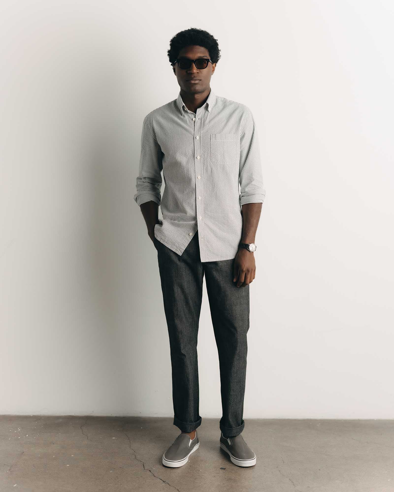 fit model posing in The Easy Pant in Black Indigo Chambray, Bottoms by Taylor Stitch