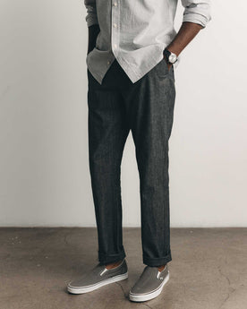 fit model standing wearing The Easy Pant in Black Indigo Chambray, Bottoms by Taylor Stitch