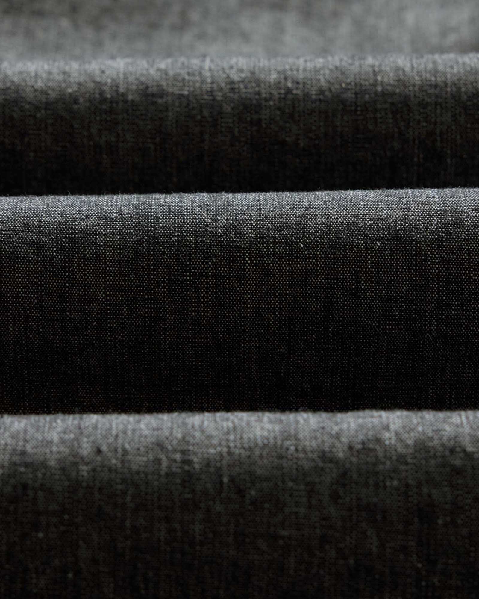 material shot of the fabric on The Easy Pant in Black Indigo Chambray, Bottoms by Taylor Stitch