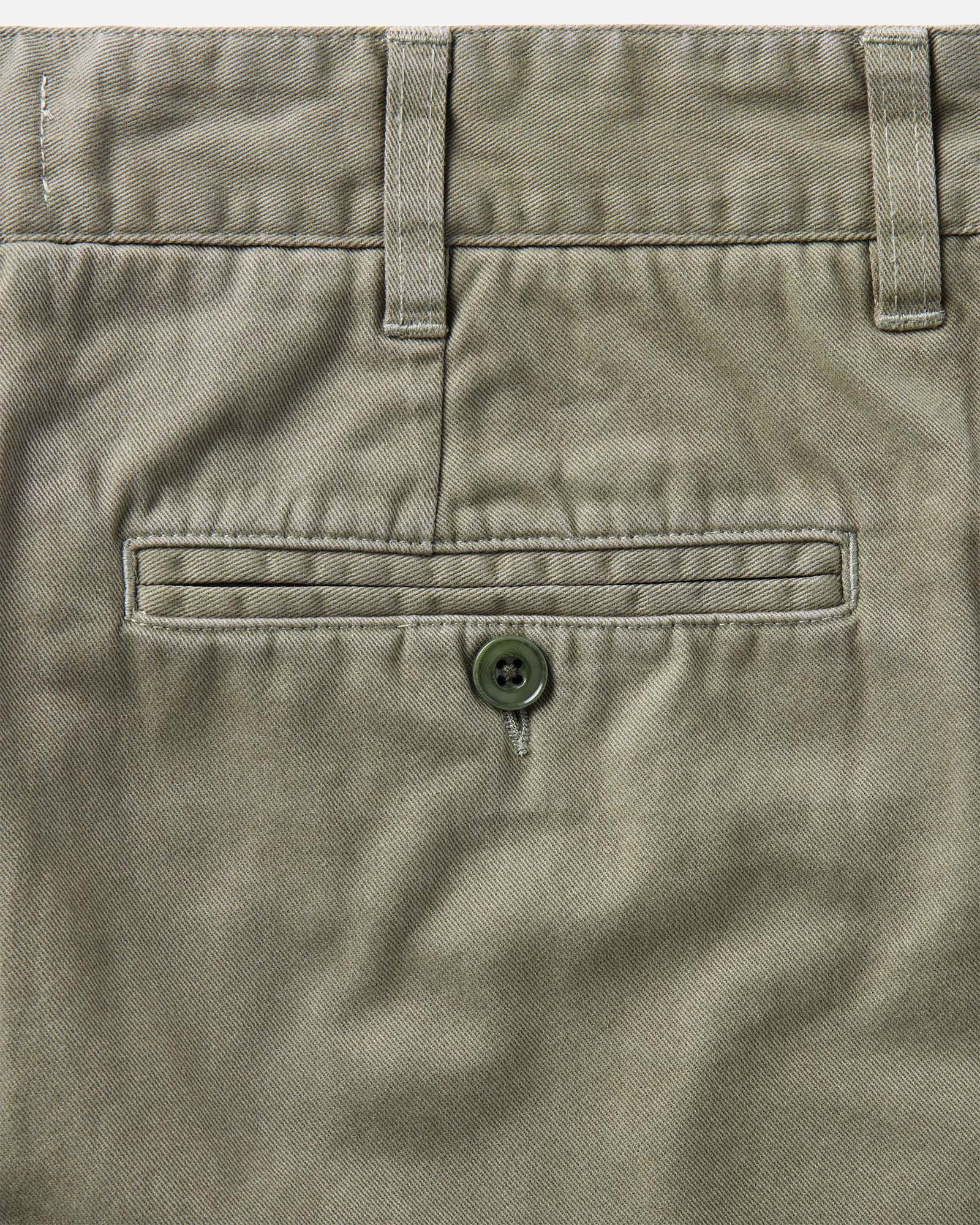material shot of the back pocket on The Foundation Short in Organic Smoked Olive, Bottoms by Taylor Stitch