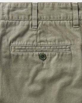 material shot of the back pocket on The Foundation Short in Organic Smoked Olive, Bottoms by Taylor Stitch