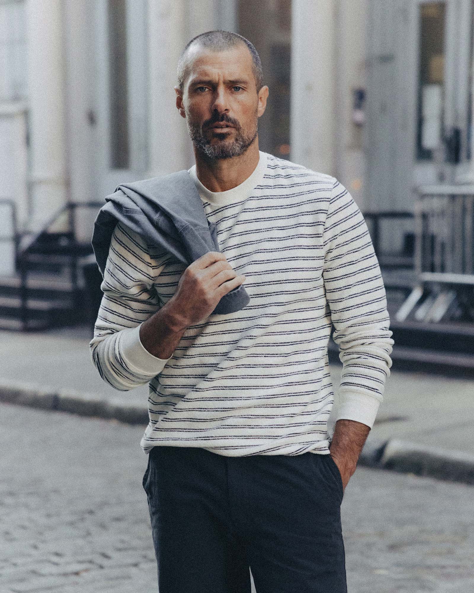 fit model posing in The Hooper Crew in Marine Stripe, Knits by Taylor Stitch