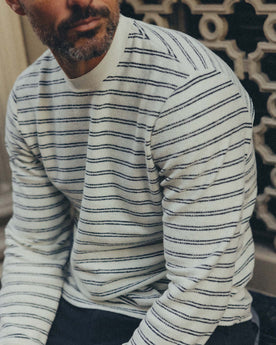 fit model sitting wearing The Hooper Crew in Marine Stripe, Knits by Taylor Stitch