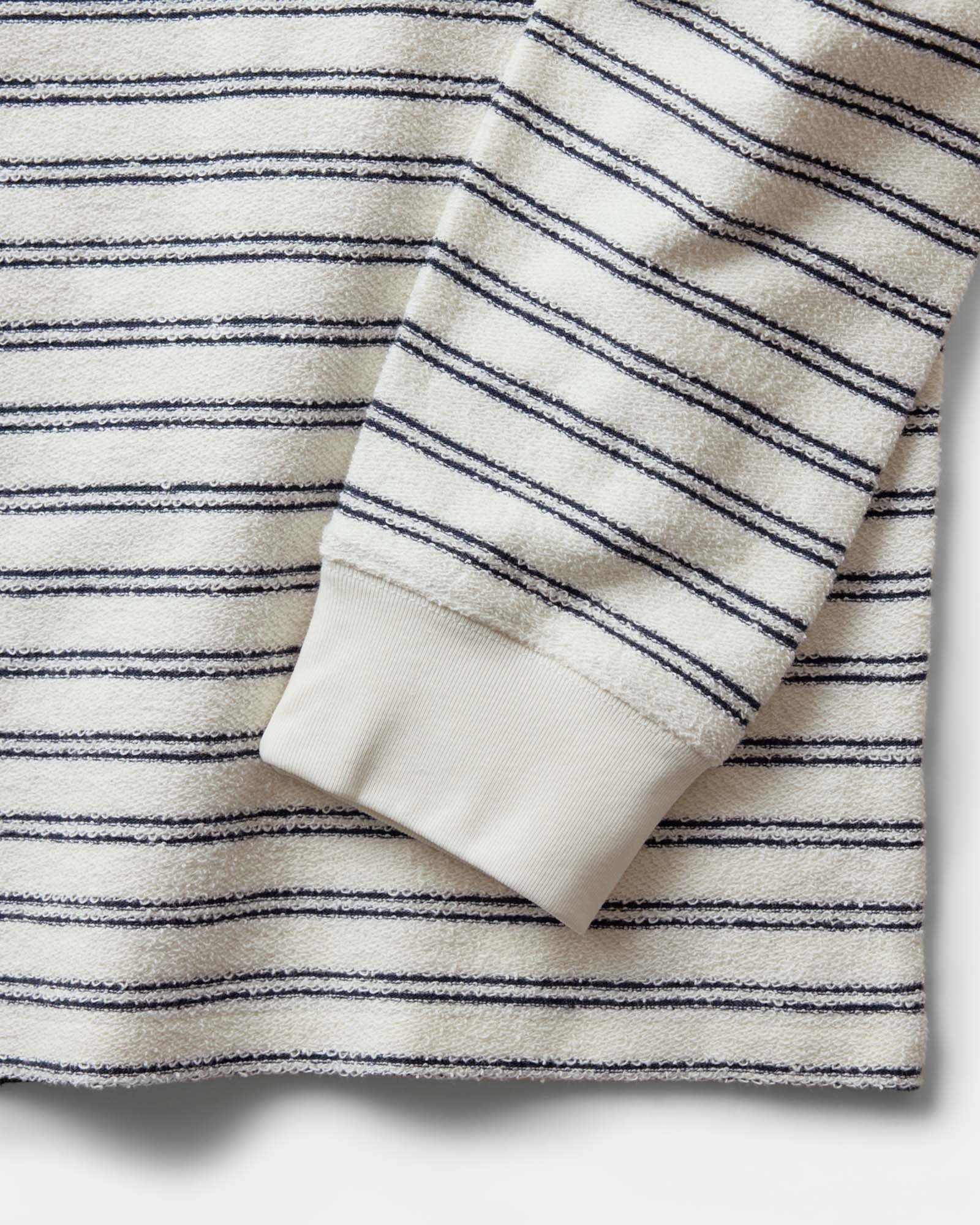 material shot of the sleeve on The Hooper Crew in Marine Stripe, Knits by Taylor Stitch