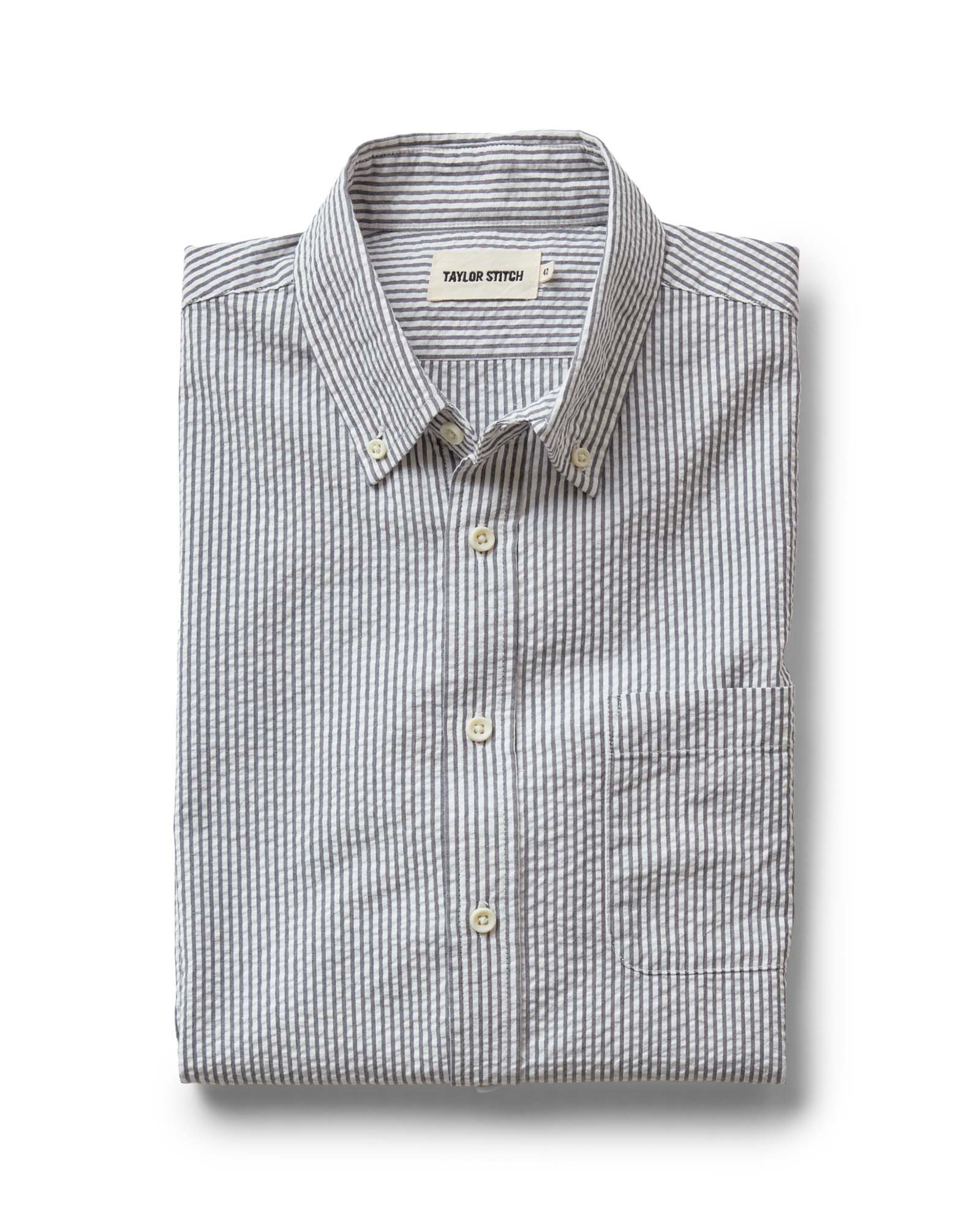 folded flatlay of The Jack in Navy Stripe Seersucker, Wovens by Taylor Stitch