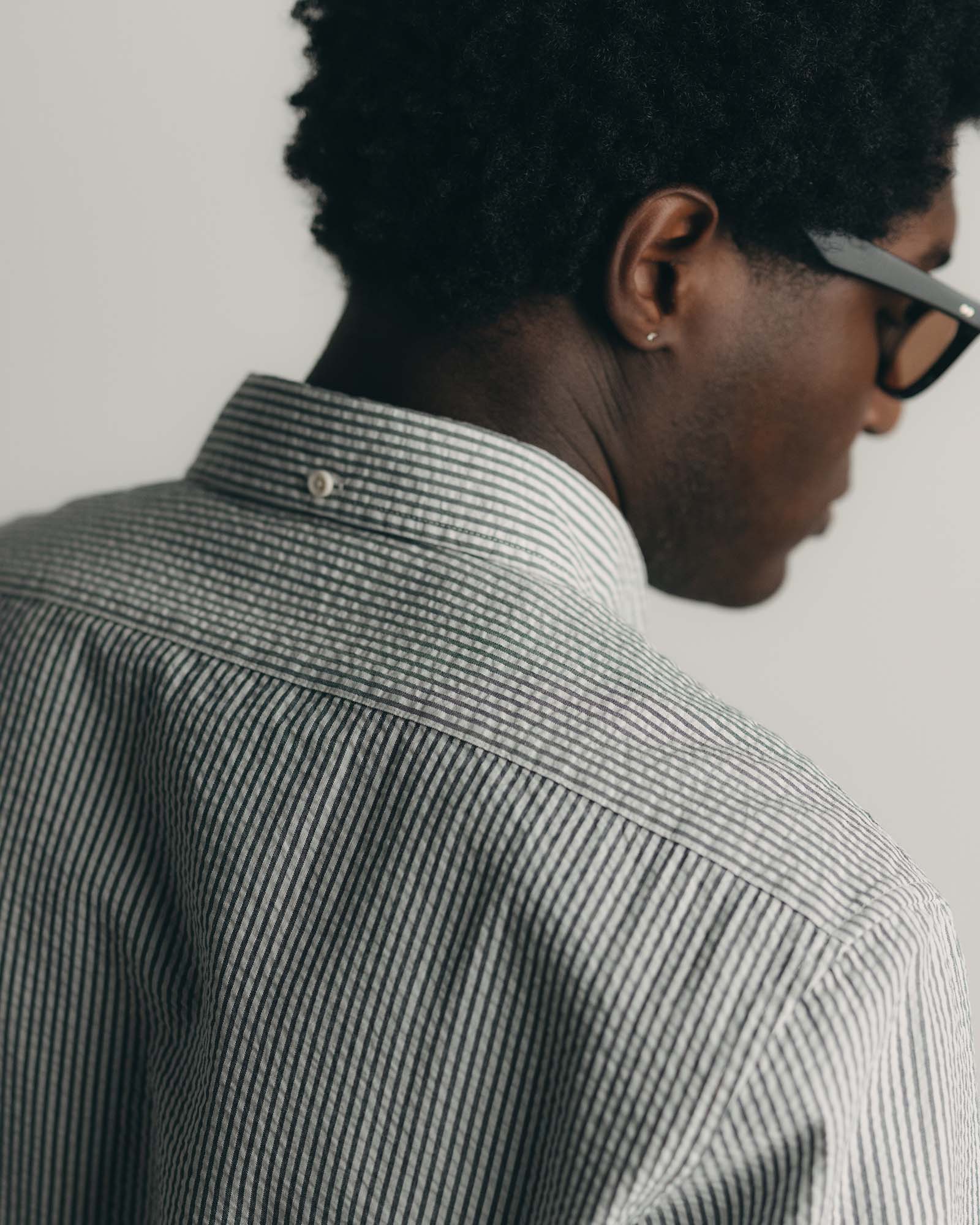 fit model showing off the back collar on The Jack in Navy Stripe Seersucker, Wovens by Taylor Stitch