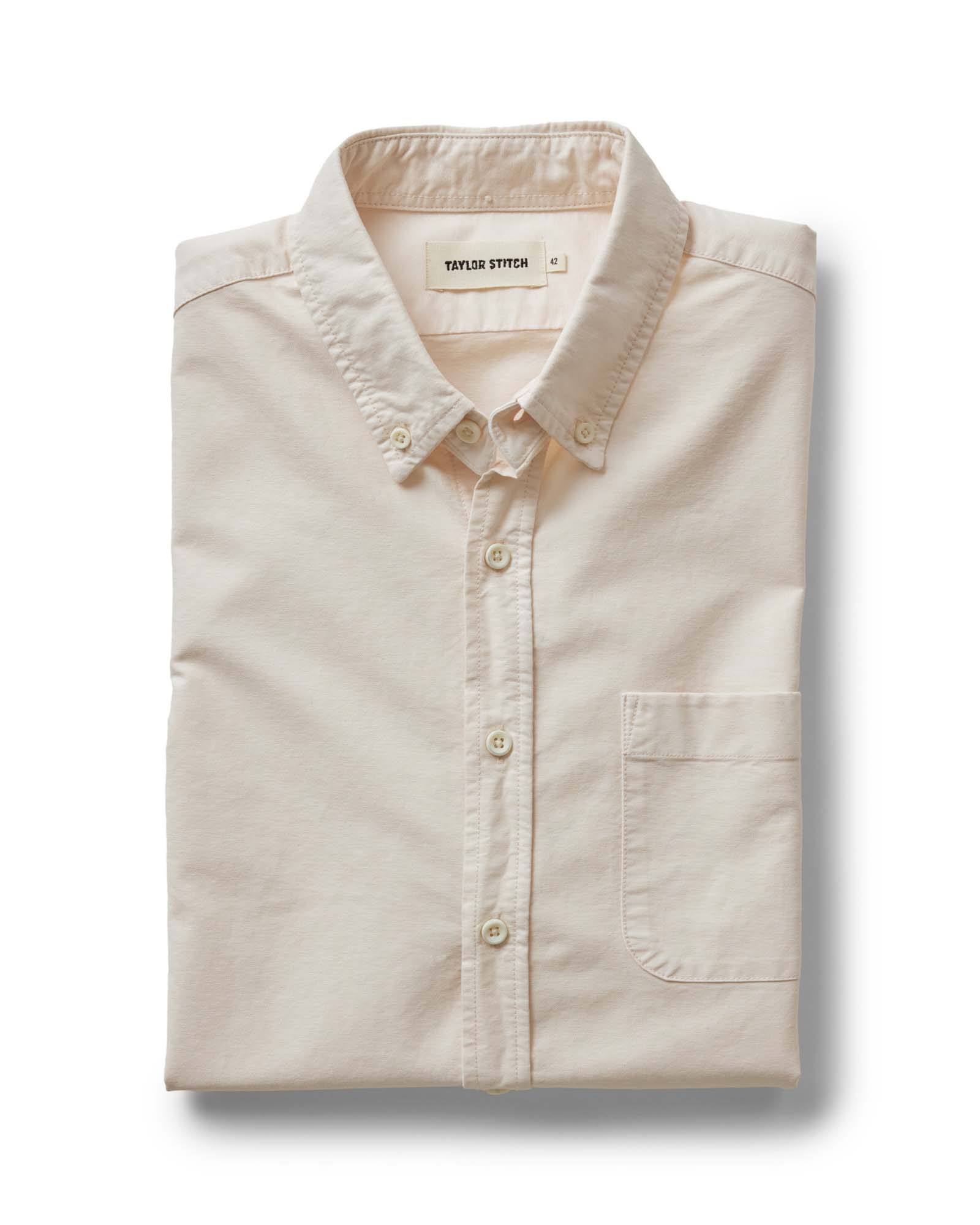 folded flatlay of The Jack in Pale Rose Oxford, Wovens by Taylor Stitch