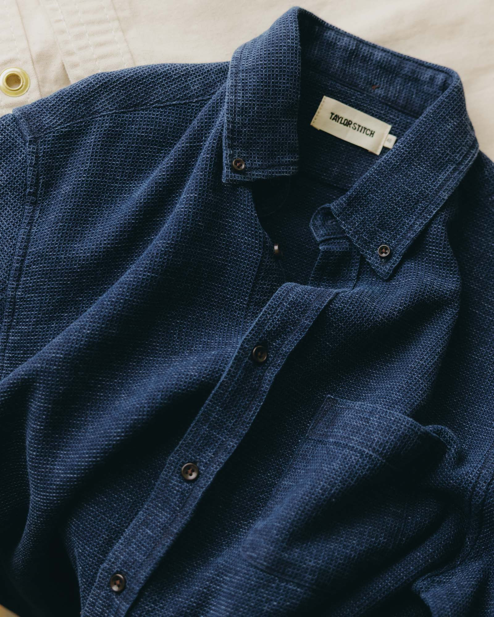 fit model walking down the stairs wearing The Jack in Indigo Waffle, Wovens by Taylor Stitch