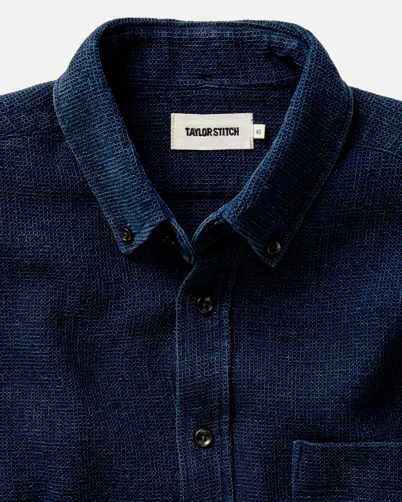 fit model showing off the buttons on The Jack in Indigo Waffle, Wovens by Taylor Stitch