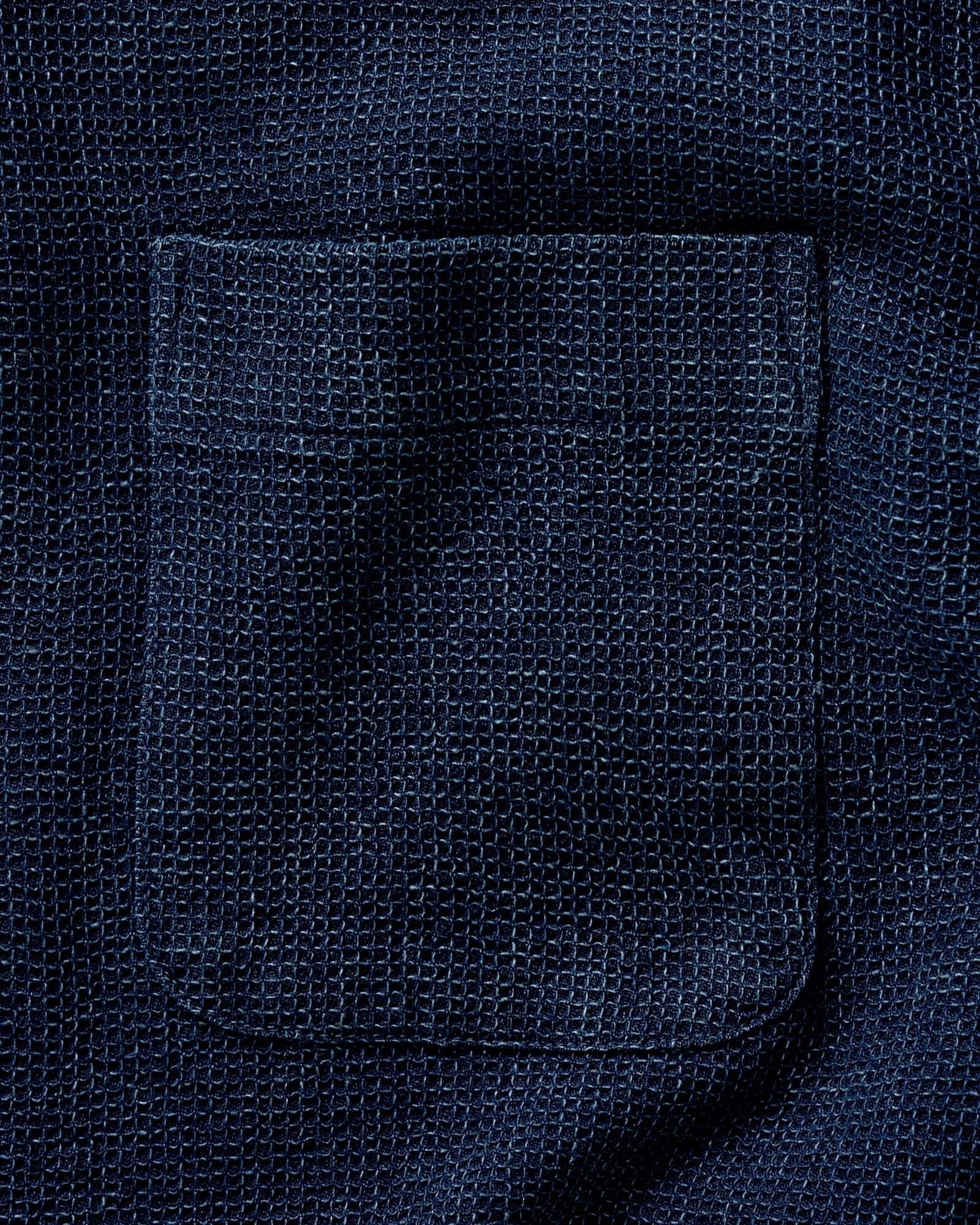 fit model with his hand in his pocket wearing The Jack in Indigo Waffle, Wovens by Taylor Stitch