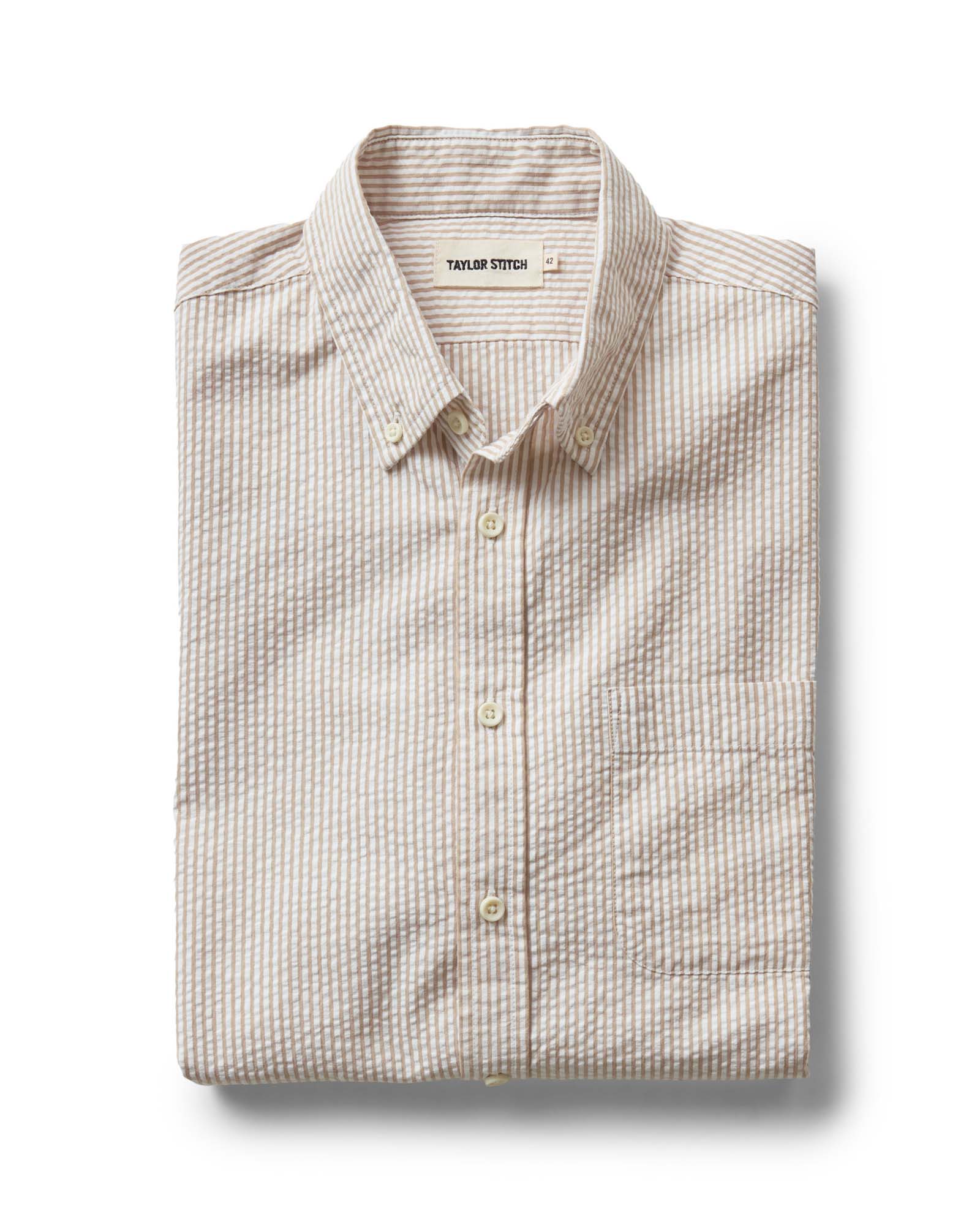 folded flatlay of The Jack in Sand Stripe Seersucker, Wovens by Taylor Stitch