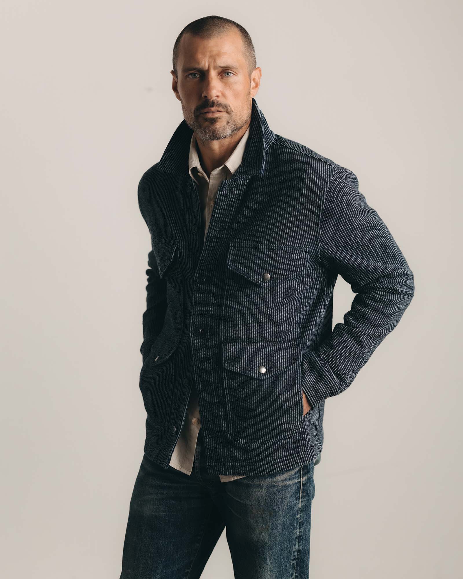 fit model posing in The Jackson Jacket in Rinsed Indigo French Terry Stripe, Outerwear by Taylor Stitch
