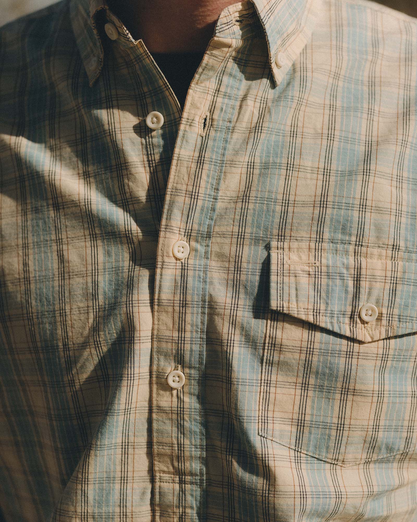 fit model showing off the buttons on The Logan Popover in Blue Sky Plaid, Wovens by Taylor Stitch