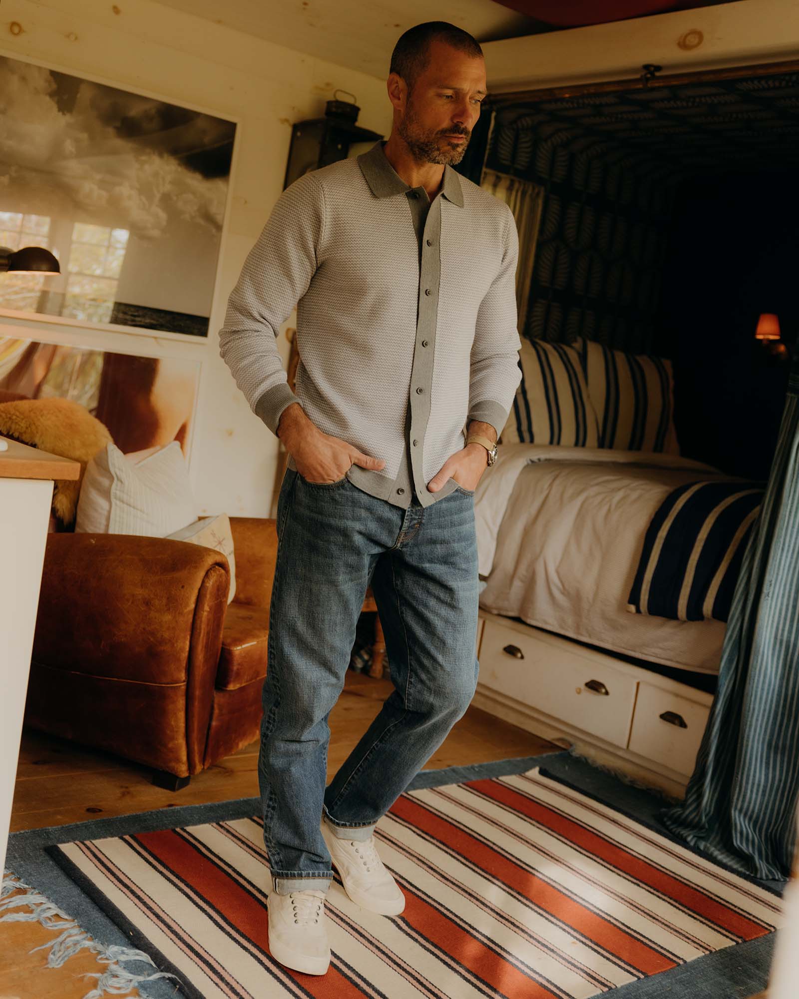 fit model walking wearing The Nichols Polo in Heather Grey Birdseye Merino, Knits by Taylor Stitch