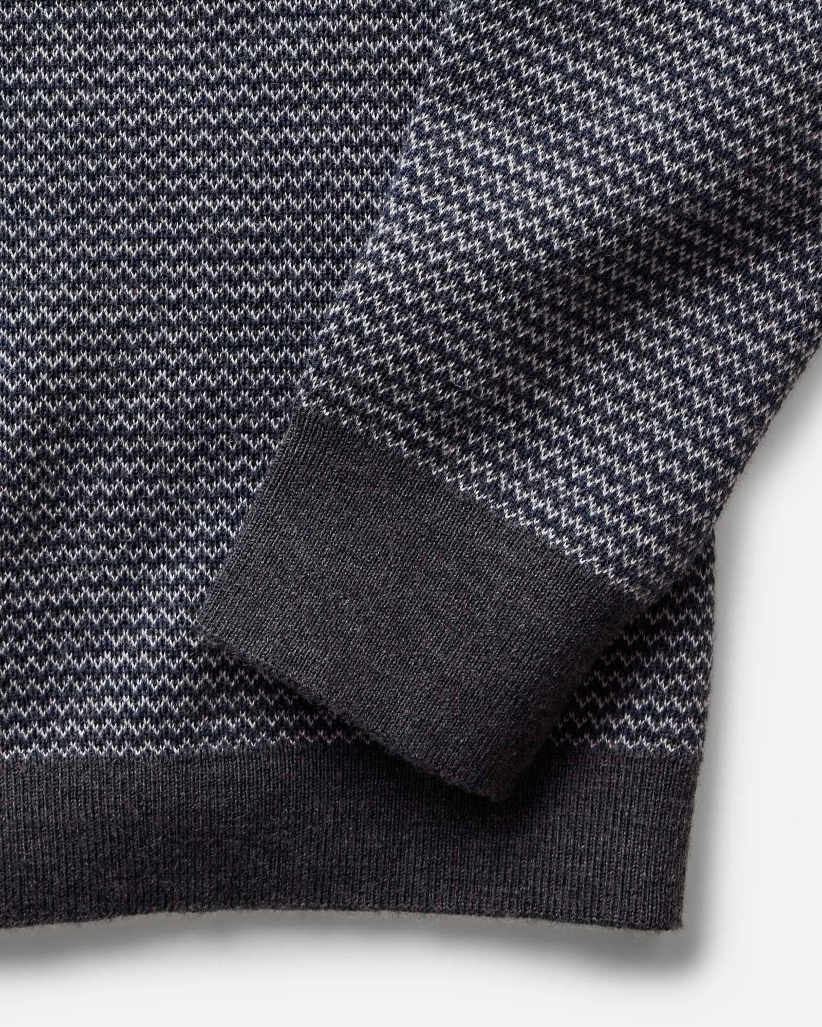 material shot of the sleeve on The Nichols Polo in Navy Birdseye Merino, Knits by Taylor Stitch