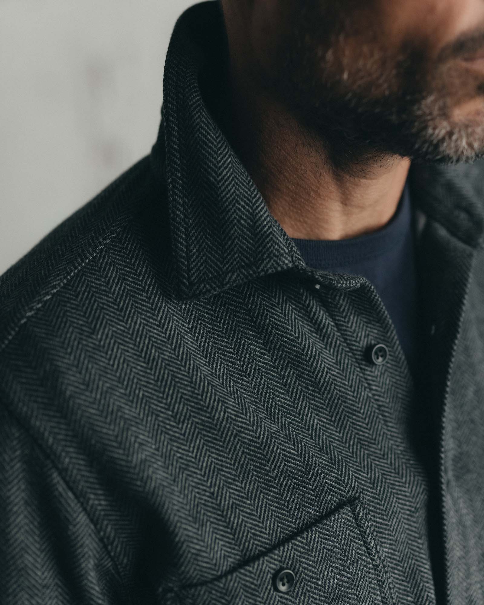 fit model showing off the collar on The North Shore Knit Shirt in Heather Coal, Knits by Taylor Stitch