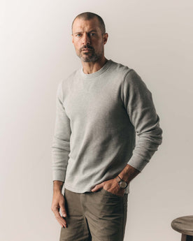 fit model sitting wearing The Organic Cotton Crew in Heather Grey Waffle, Knits by Taylor Stitch