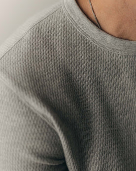 fit model adjusting collar on The Organic Cotton Crew in Heather Grey Waffle, Knits by Taylor Stitch