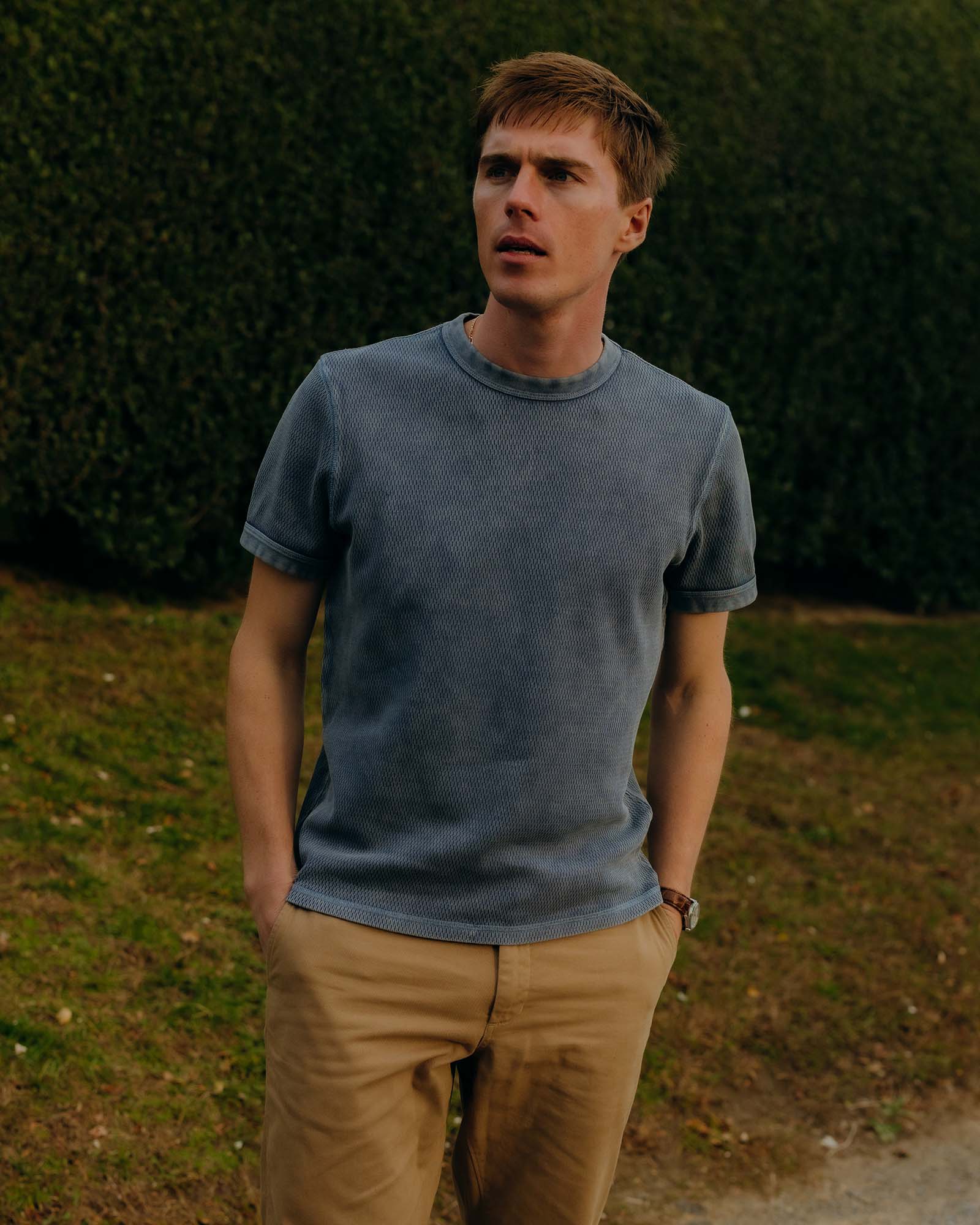 fit model posing in The Organic Cotton Short Sleeve Crew in Washed Blue Waffle, Knits by Taylor Stitch