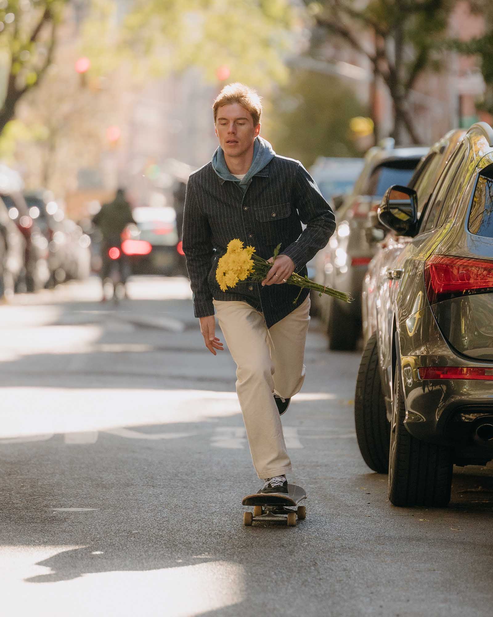 fit model skateboarding wearing The Painter Pant in Seeded Natural Chipped Canvas, Bottoms by Taylor Stitch