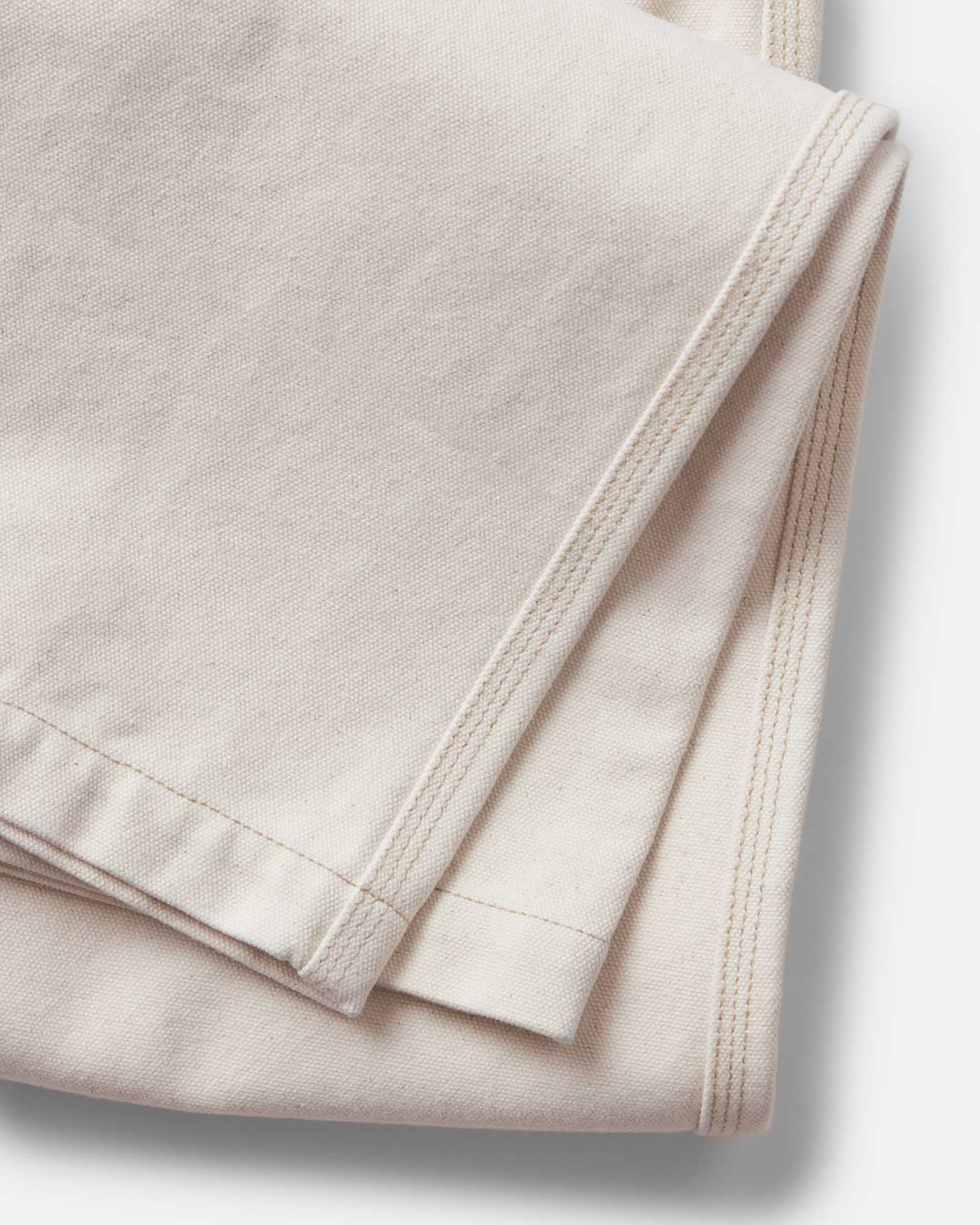material shot of the hem on The Painter Pant in Seeded Natural Chipped Canvas, Bottoms by Taylor Stitch