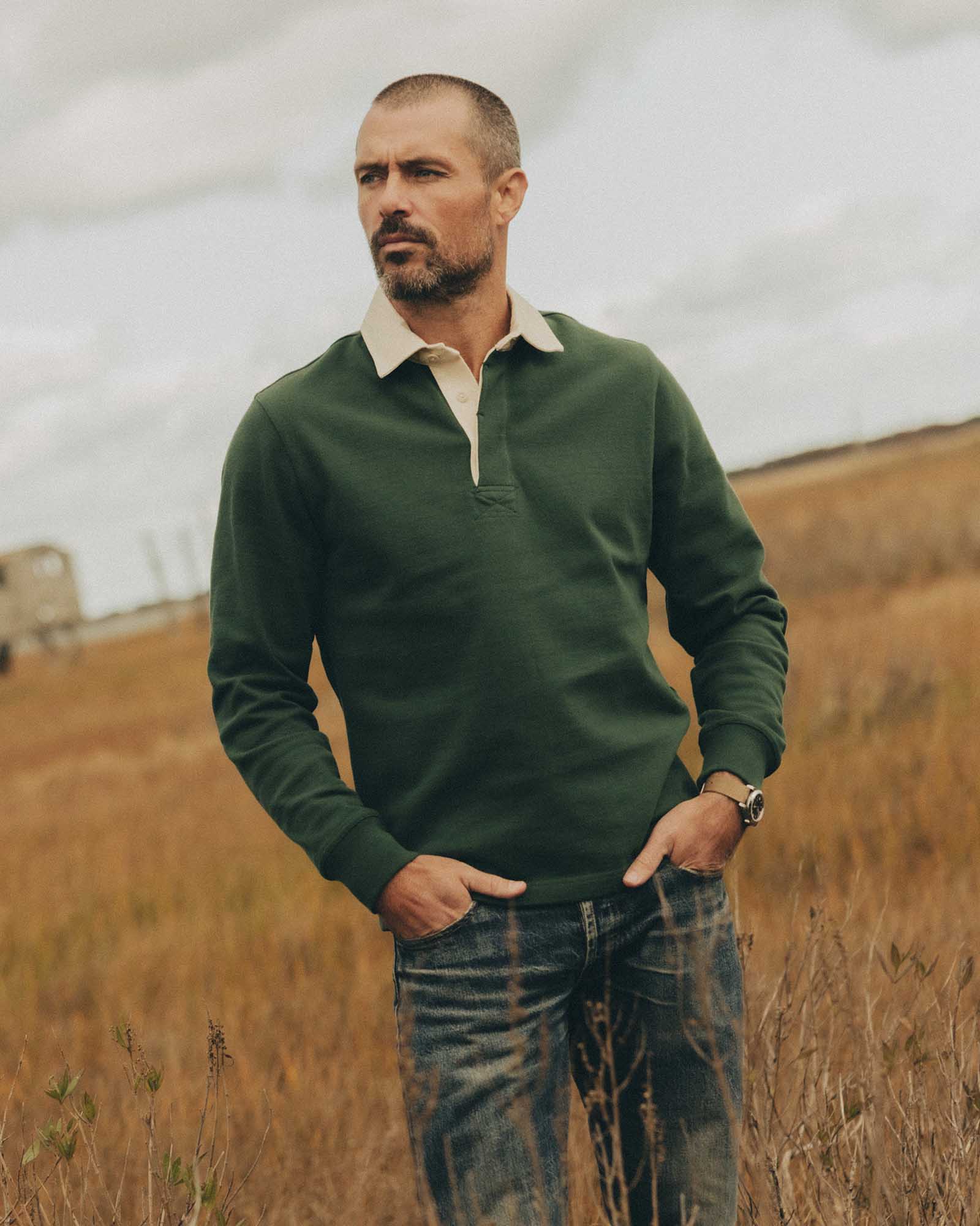 fit model posing in The Rugby Shirt in Ivy, Knits by Taylor Stitch