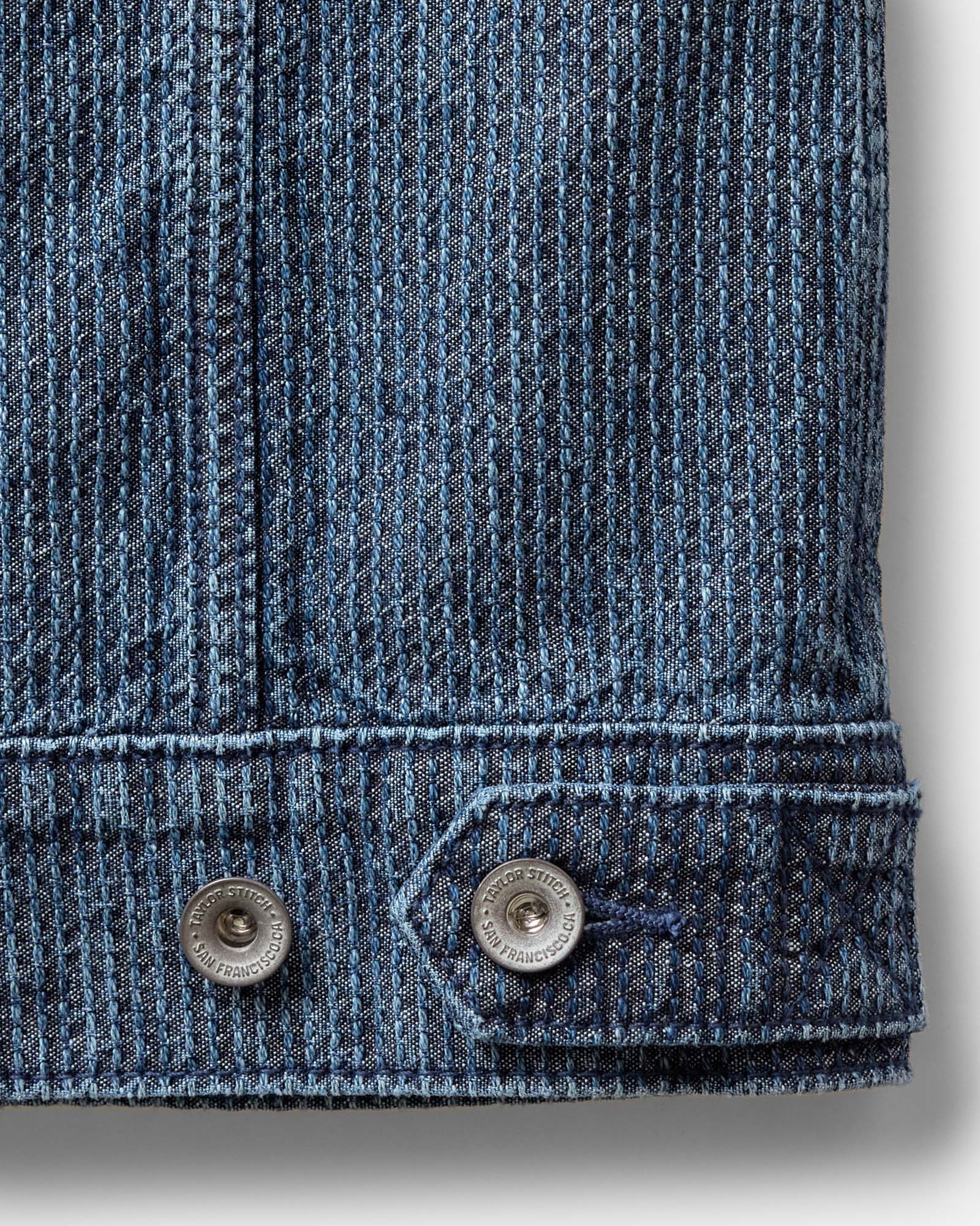 material shot of the buttons on The Ryder Jacket in Japanese Washed Indigo Sashiko, Outerwear by Taylor Stitch