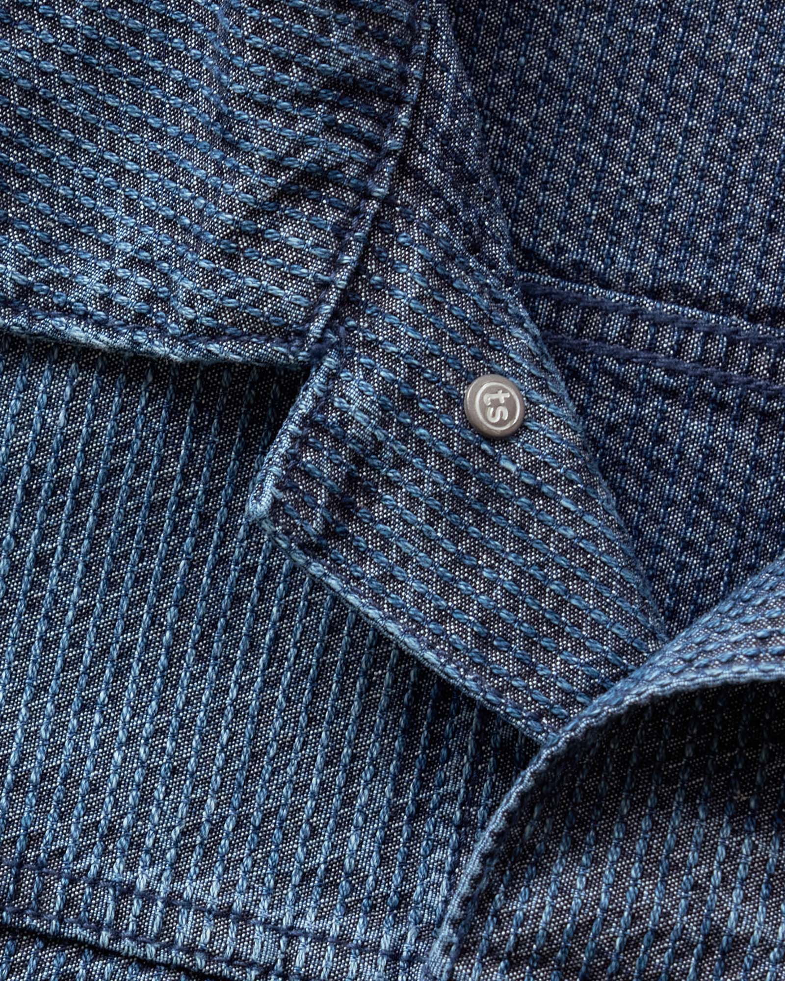 material shot of the back of a button on The Ryder Jacket in Japanese Washed Indigo Sashiko, Outerwear by Taylor Stitch