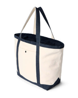 editorial image of the side of The Schooner Tote in Seeded Natural Chipped Canvas, Accessories by Taylor Stitch