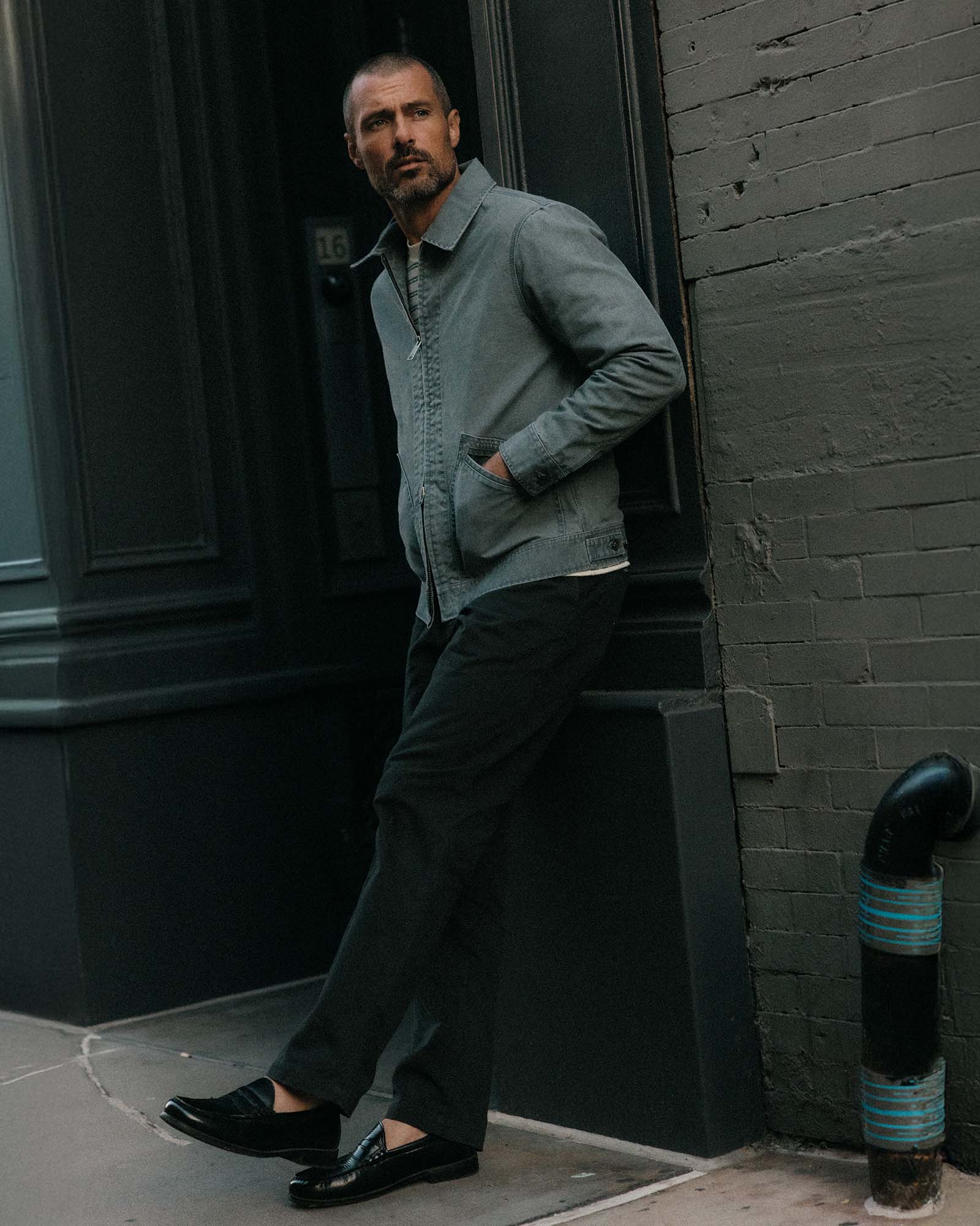 fit model posing in The Shifter Jacket in Dark Grey Pigment Canvas, Outerwear by Taylor Stitch