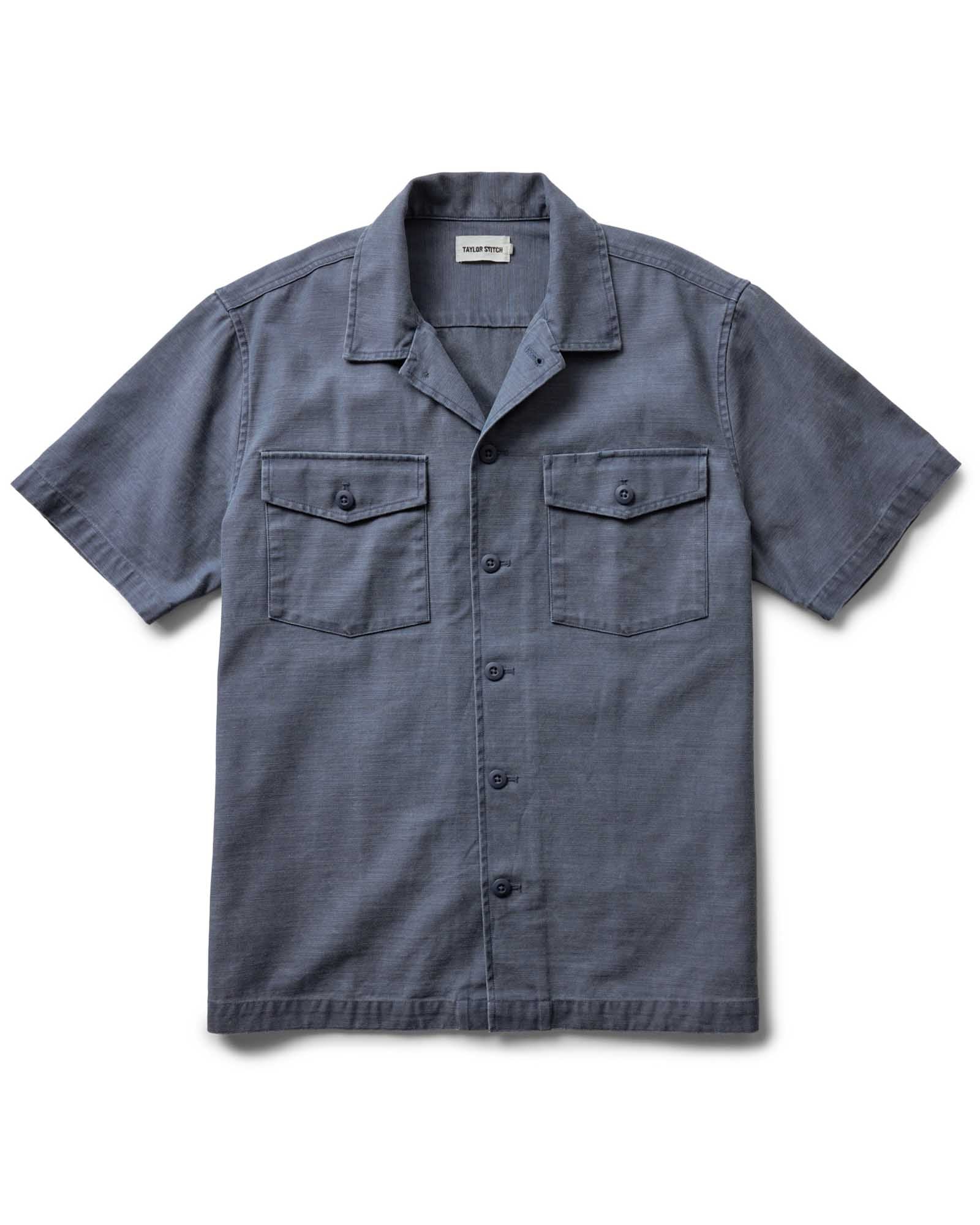 flatlay of The Short Sleeve Surplus Shirt in Dark Navy Reverse Sateen, Wovens by Taylor Stitch